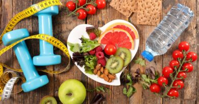 healthy food, apple, water bottle, dumbbells for workout
