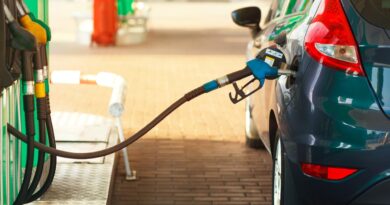 a car is being refueled at a gas station