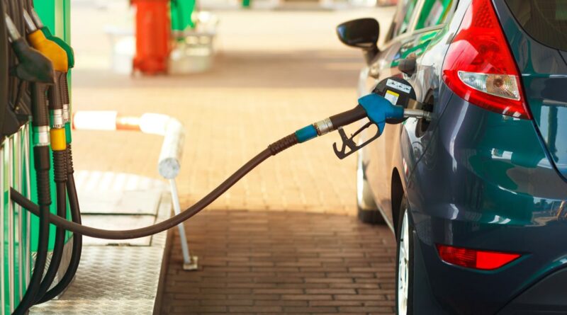 a car is being refueled at a gas station