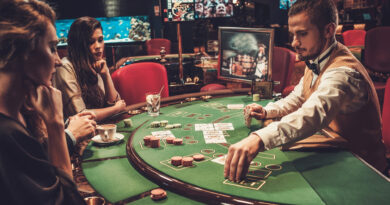 women playing poker in a casino with a croupier