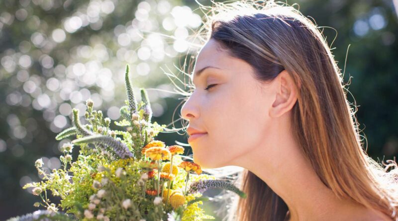 woman smells a pleasant aroma