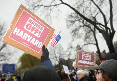 FILE PHOTO: Demonstrators rally on Cambridge Common in a protest organized by the City of Cambridge against interference by the federal government, in Cambridge