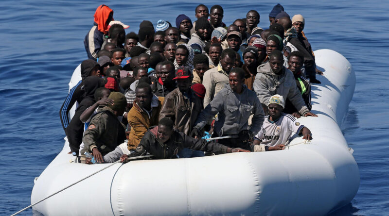 Migrants seen in boat after being rescued in Mediterranean Sea